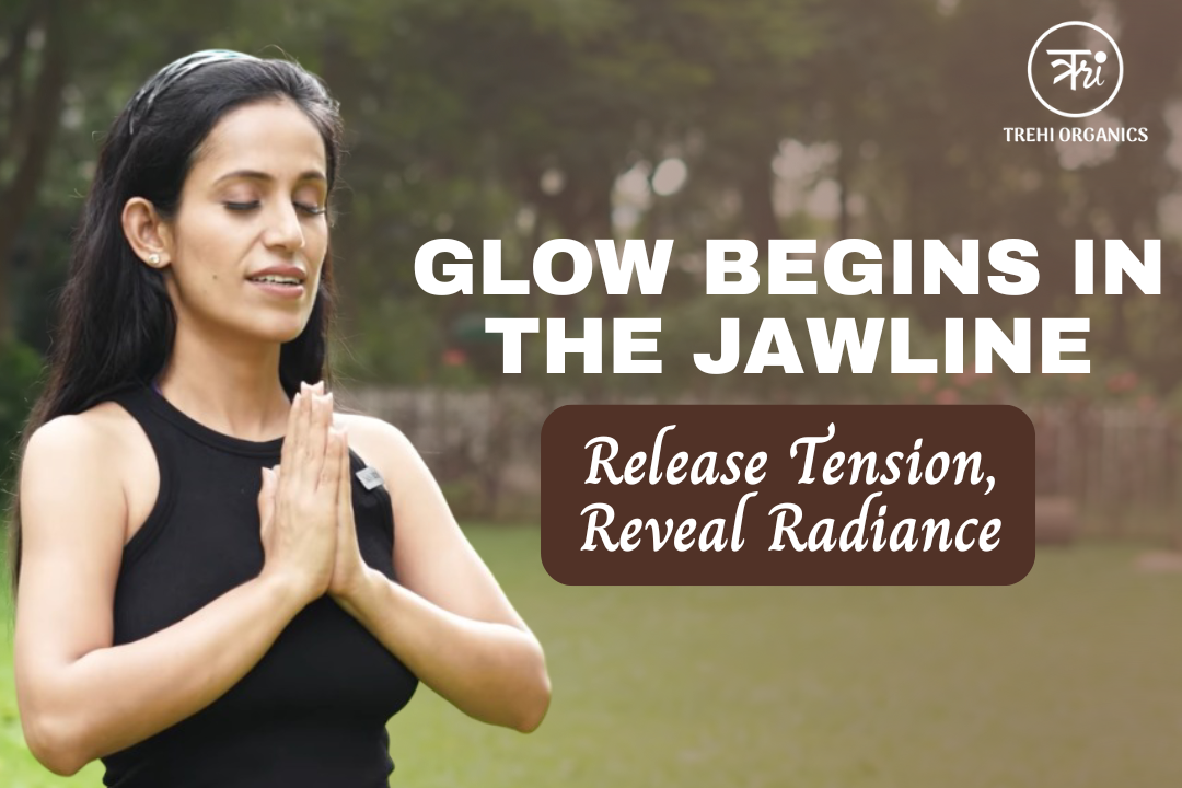A woman practicing a calming jaw-release posture outdoors with hands in namaste, representing how jaw tension affects puffiness and dark circles. 